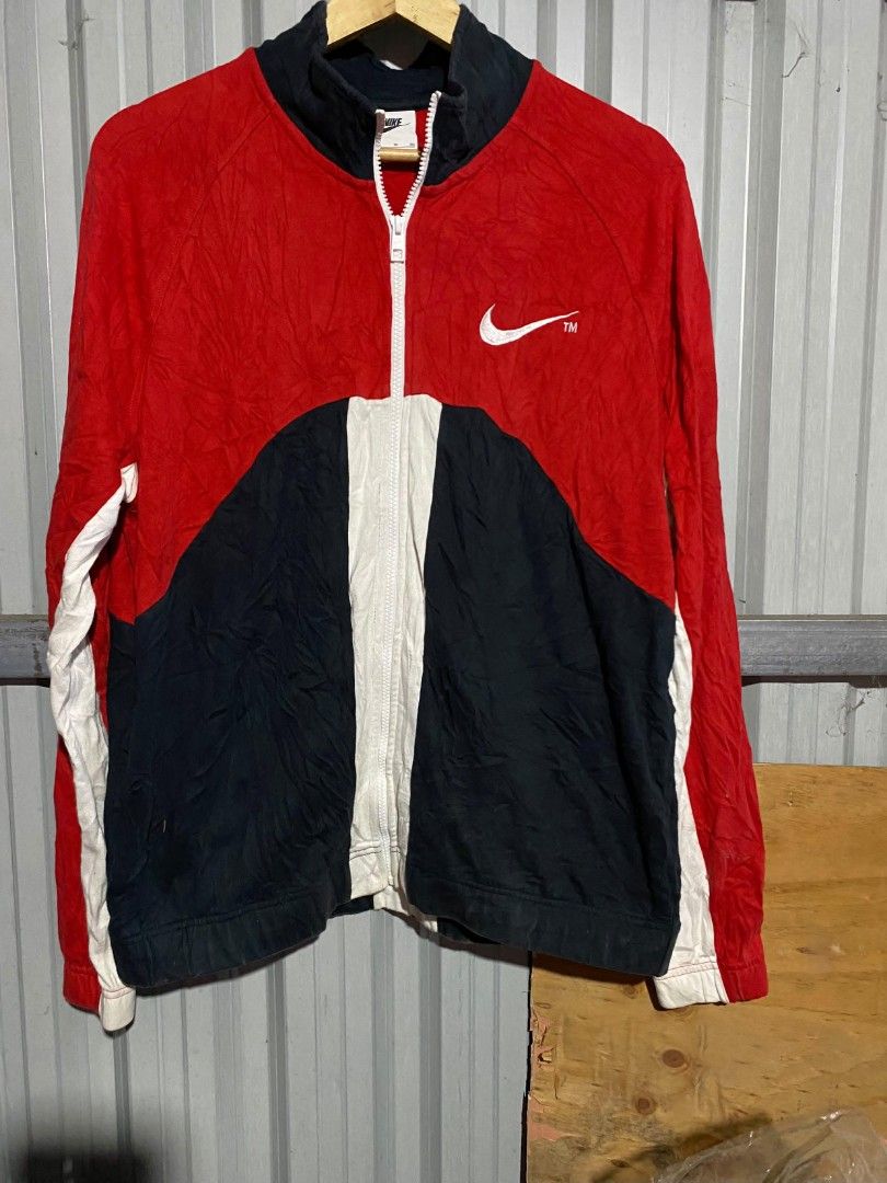 Nike Vintage Colorblock Full Zip Track Jacket (Category: Coats, Jackets and Outerwear) located in Bacolod City. Submitted by carlo1019 (Listing ID 1465385198, Image 1). Description: - Brand: Nike - Style: Full-zip colorblock jacket (Red/Black/White) - Size: XL - Details: High collar neckline, white Swoosh printed on chest and back, registered trademark text on rear lower panel - Style Code: DD5982-657 - Condition: 100% authentic and well-maintain