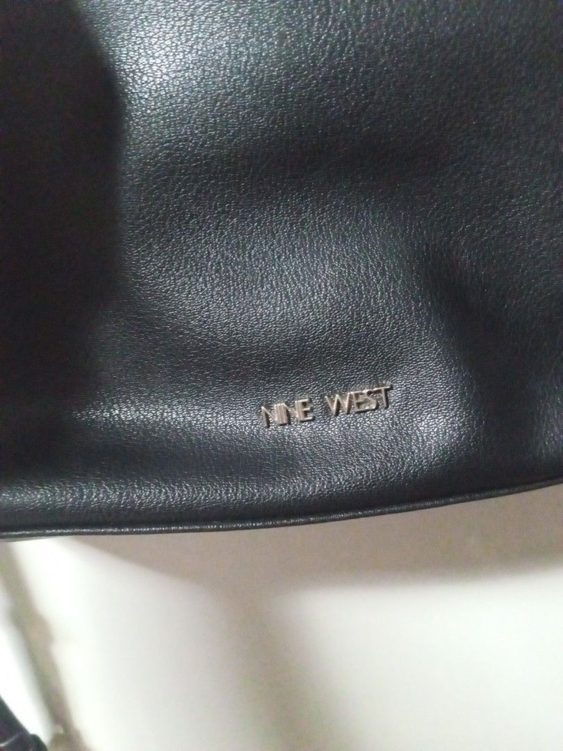 Nine West Black Crossbody Bag (Category: Cross-body Bags) located in Tagbilaran City. Submitted by margusatgil (Listing ID 1465421449, Image 2). Description: - Brand: Nine West - Color: Classic Black with chic gold-tone hardware - Material: Premium faux leather texture - Closure: Secure top zipper - Interior: Clean lining with handy slip pockets and multiple compartments - Strap: Adjustable for a custom fit - Style: Versatile and minimalist, perf