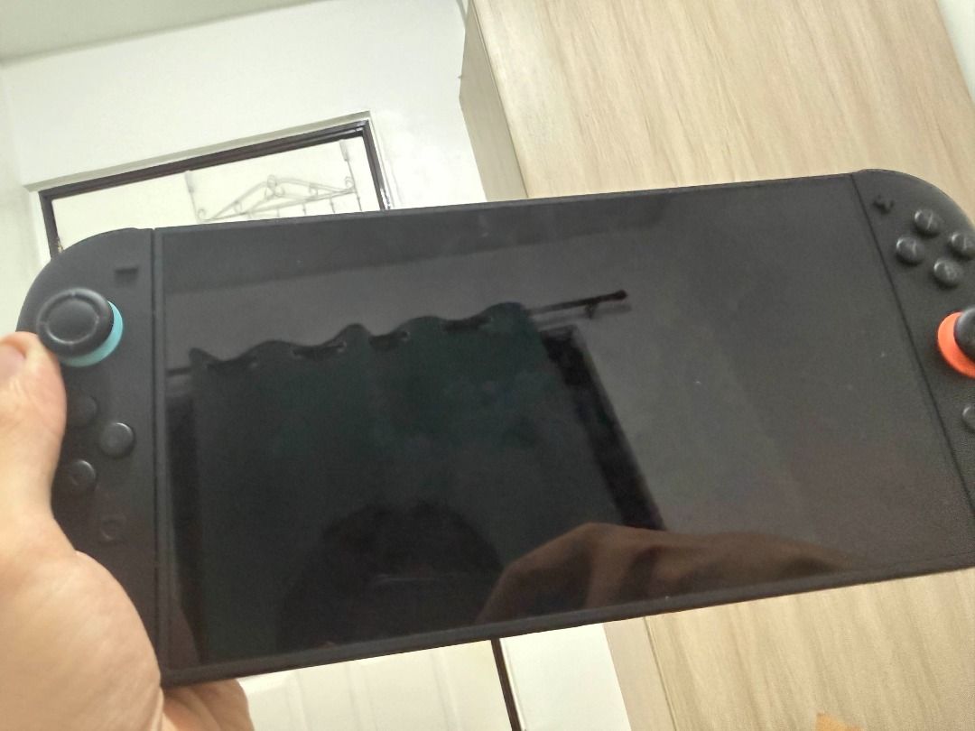 Nintendo Switch 2 (Category: Nintendo) located in Caloocan City. Submitted by karlpatric37041 (Listing ID 1465437257, Image 1). Description: - Console: Nintendo Switch 2 - Joy-Cons: Equipped with teal (left) and orange (right) thumb grips - Screen Condition: Clean, no major scratches visible, lightly used - Play Mode: Supports both handheld and docked gaming - Connectivity/Charging: Charges via USB-C - Status: Tested and ready to play.