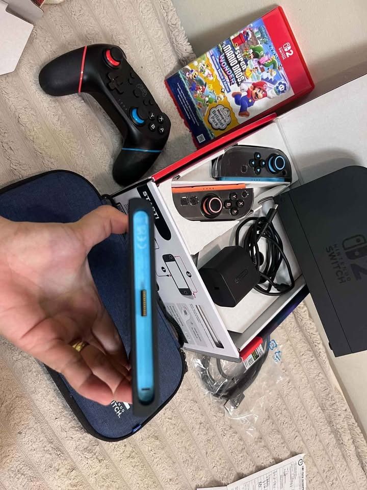 NINTENDO SWITCH 2 5 MONTHS OLD (Category: Nintendo) located in Caloocan City. Submitted by princesscuenco.503 (Listing ID 1465387327, Image 2). Description: - Complete Nintendo Switch console with dock - Includes vibrant Blue and Orange Joy-Cons plus charging grip - Comes with Super Mario Bros Wonder physical game cartridge - Includes power adapter, HDMI cable, and stylish blue carrying case - Ready to play out of the box, perfect gift bundle!.