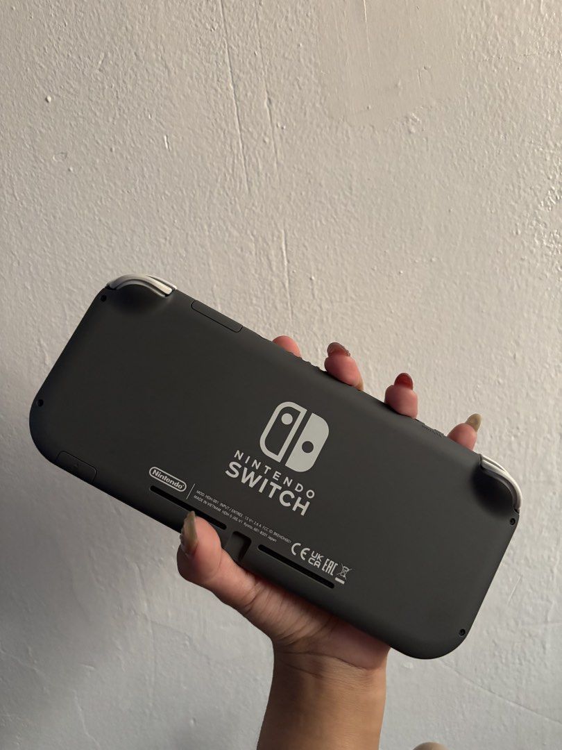 Nintendo Switch Lite Gray (Category: Nintendo) located in Las Pinas. Submitted by ryfran (Listing ID 1465462921, Image 3). Description: Nintendo Switch Lite Gray - 5months old - lightly used, no signs of usage - crisp buttons - with orig box and charger - with digital games.