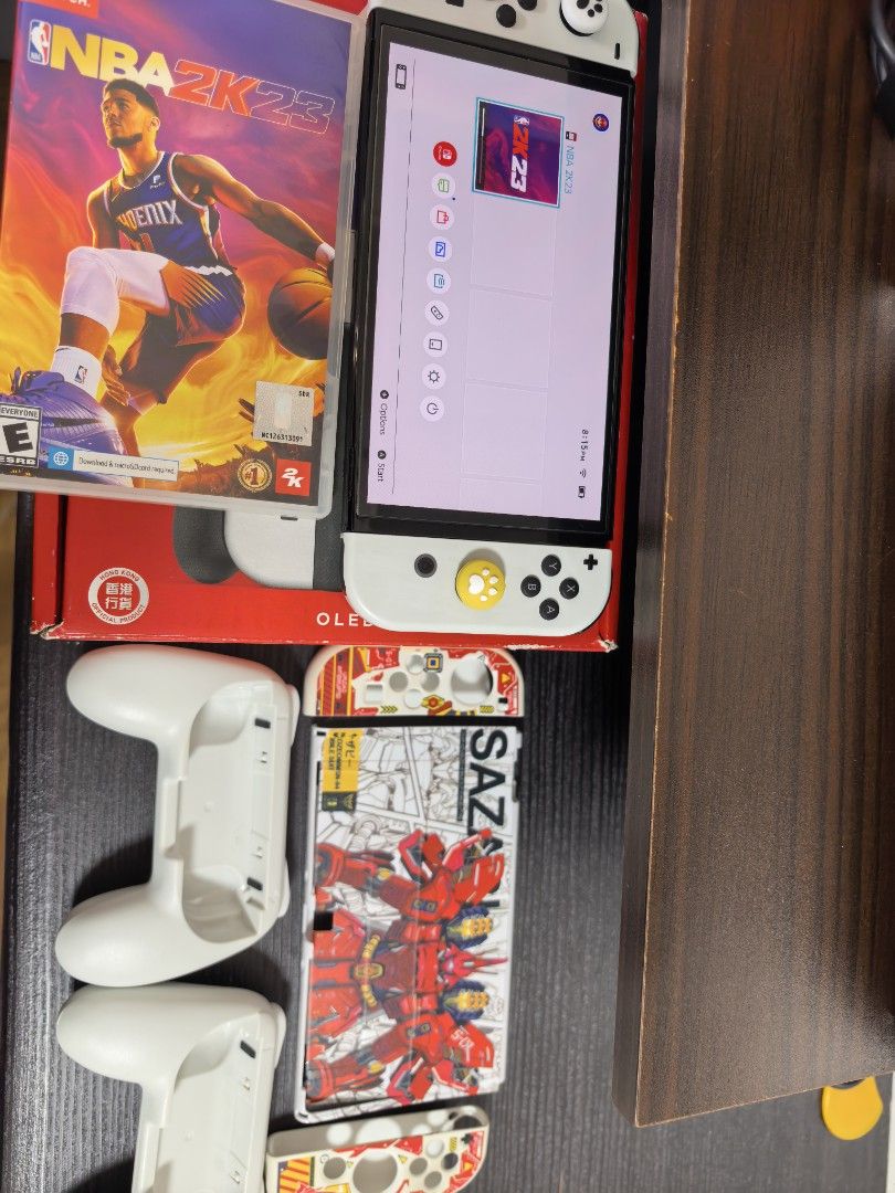 Nintendo Switch OLED (Category: Nintendo) located in Navotas City. Submitted by emembravocastillo (Listing ID 1465409971, Image 3). Description: (FOR SALE PO SECOND HAND NINTENDO SWITCH OLED WHITE) 10K. With complete original accessories. Dock, HDMI Cord, Grip, Straps, Charger. With box naka tempered na din po. Free case free thumb grip free 1 physical game NBA 2K23. (WALA NG RECIBO) Issue sa may rubber ng analog medyo na pudpod na pero walang af