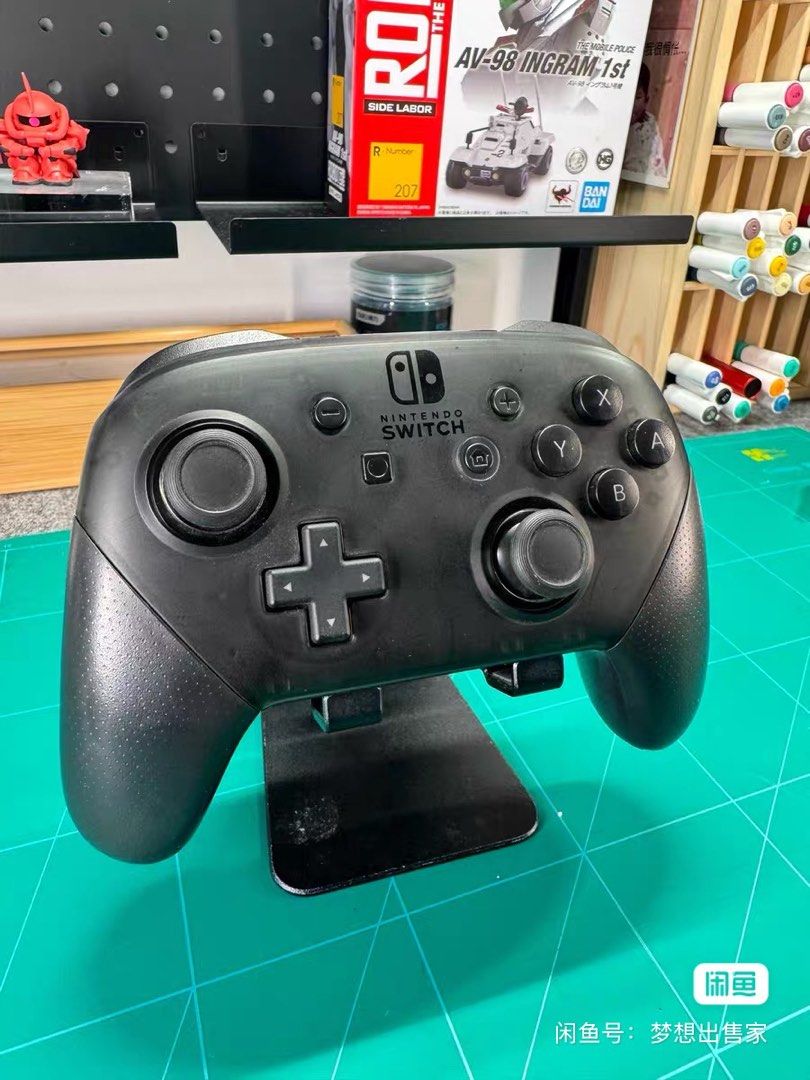 Nintendo Switch Pro Controller (Category: Controllers) located in Singapore. Submitted by yangyangyang1100 (Listing ID 1465538240, Image 2). Description: - Official Nintendo Switch Pro Controller (Black) - Traditional gamepad layout with dual analog sticks, D-pad, and face buttons - Textured grips for enhanced hold and comfort during extended play - Wireless connectivity for seamless console gaming - USB-C charging port located on the top edge.