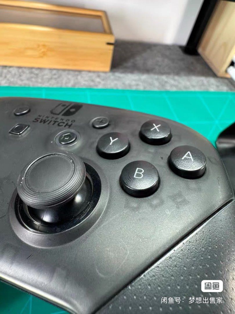 Nintendo Switch Pro Controller (Category: Controllers) located in Singapore. Submitted by yangyangyang1100 (Listing ID 1465538240, Image 3). Description: - Official Nintendo Switch Pro Controller (Black) - Traditional gamepad layout with dual analog sticks, D-pad, and face buttons - Textured grips for enhanced hold and comfort during extended play - Wireless connectivity for seamless console gaming - USB-C charging port located on the top edge.
