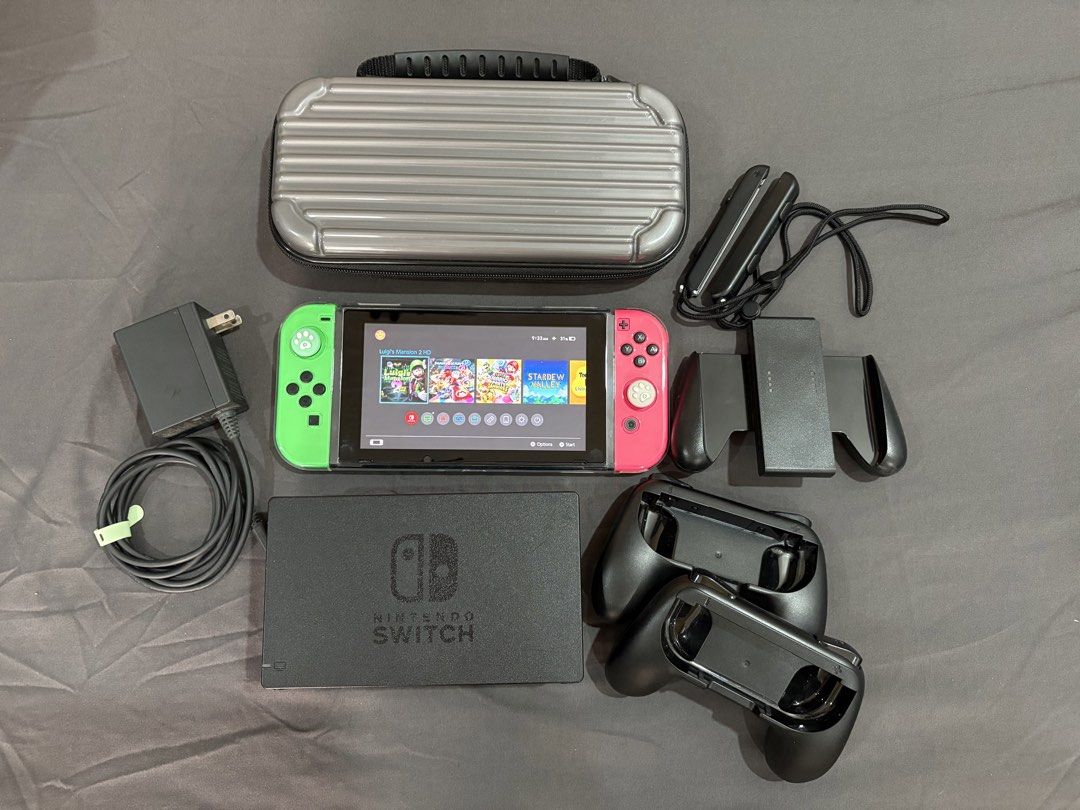 Nintendo Switch V1 (Category: Nintendo) located in Porac. Submitted by Nini_02 (Listing ID 1465392176, Image 1). Description: Nintendo Switch V1 - Jailbreak (Offline mode only) - No Issue, unit is in good condition - Download any games thru pc - All buttons are working - Original Joycon Left & Right - 128 gb sd card - No HDMI - Original Charger - Original Dock - With controller grip accessories - With travel bag Location: Pampanga.