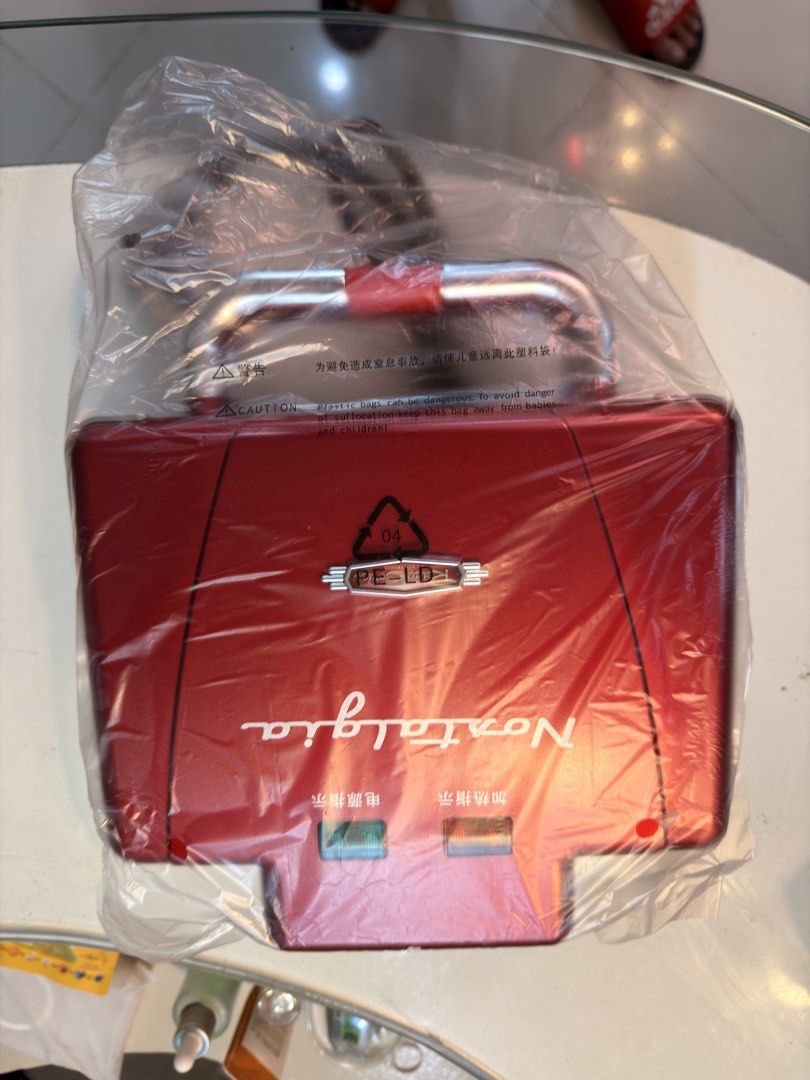 Nostalgia Retro Mini Sandwich Maker Red (Category: Breadmakers) located in Taguig. Submitted by jbadz19 (Listing ID 1465482121, Image 3). Description: - Vibrant red retro mini sandwich maker - Bakes two golden brown sandwiches simultaneously - Die-cast aluminum griddle plates for even heat distribution - Non-stick cooking plates for quick and easy cleanup - Locking latch for secure baking - Convenient power and heat indicator lights - Comes with 
