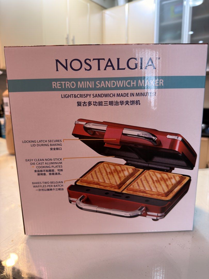 Nostalgia Retro Mini Sandwich Maker Red (Category: Breadmakers) located in Taguig. Submitted by jbadz19 (Listing ID 1465482121, Image 1). Description: - Vibrant red retro mini sandwich maker - Bakes two golden brown sandwiches simultaneously - Die-cast aluminum griddle plates for even heat distribution - Non-stick cooking plates for quick and easy cleanup - Locking latch for secure baking - Convenient power and heat indicator lights - Comes with 