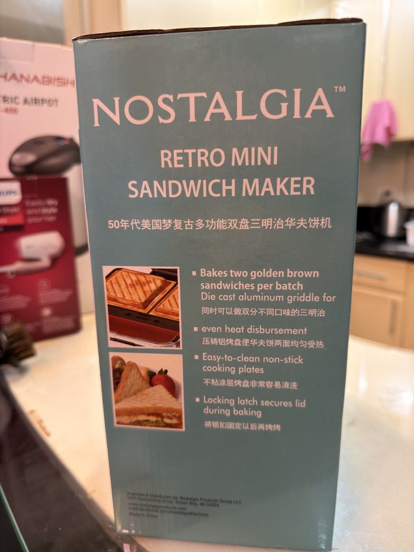 Nostalgia Retro Mini Sandwich Maker Red (Category: Breadmakers) located in Taguig. Submitted by jbadz19 (Listing ID 1465482121, Image 2). Description: - Vibrant red retro mini sandwich maker - Bakes two golden brown sandwiches simultaneously - Die-cast aluminum griddle plates for even heat distribution - Non-stick cooking plates for quick and easy cleanup - Locking latch for secure baking - Convenient power and heat indicator lights - Comes with 