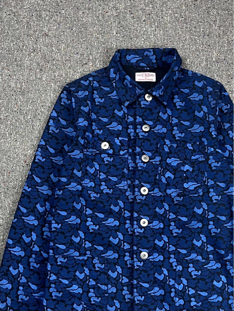 Not Rigid by Bitter Ender Abstract Graphic blue Camouflage pattern chore jacket (Category: Coats, Jackets and Outerwear) located in Zamboanga. Submitted by rag_20 (Listing ID 1465555369, Image 2). Description: Not Rigid by Bitter Ender Abstract Graphic blue Camouflage pattern chore jacket a piece from a prominent Japanese casual streetwear label. It features an all-over blue abstract graphic camouflage pattern, a classic pointed collar, a central