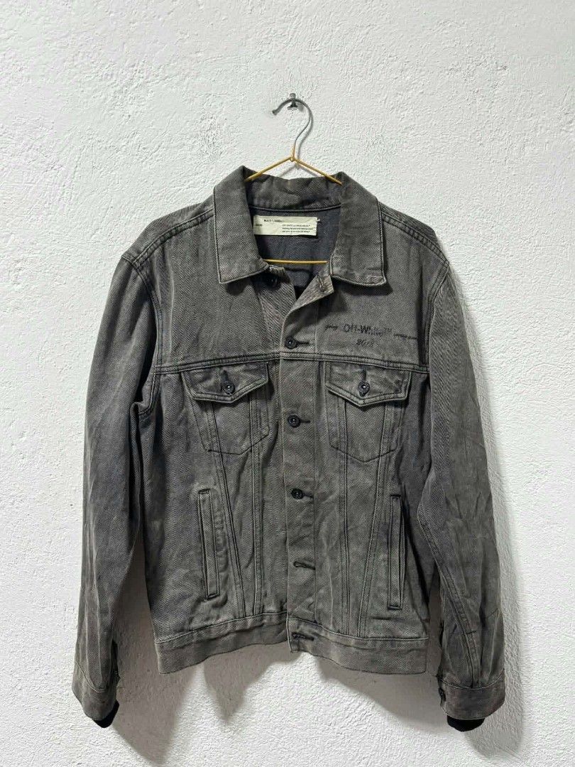 Off-White Denim Jacket Distressed Back Graphic Print (Category: Coats, Jackets and Outerwear) located in San Jose. Submitted by garments17 (Listing ID 1465405631, Image 1). Description: - Brand: Off-White - Color: Washed charcoal grey with slight fading - Material: Heavyweight denim fabric - Design: Button-front closure, chest pockets, and side welt pockets - Back Detail: Large distressed rectangular patch cut-out featuring an artistic graphic pr