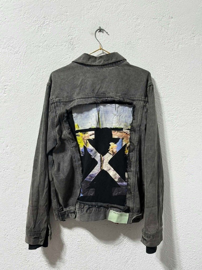 Off-White Denim Jacket Distressed Back Graphic Print (Category: Coats, Jackets and Outerwear) located in San Jose. Submitted by garments17 (Listing ID 1465405631, Image 2). Description: - Brand: Off-White - Color: Washed charcoal grey with slight fading - Material: Heavyweight denim fabric - Design: Button-front closure, chest pockets, and side welt pockets - Back Detail: Large distressed rectangular patch cut-out featuring an artistic graphic pr