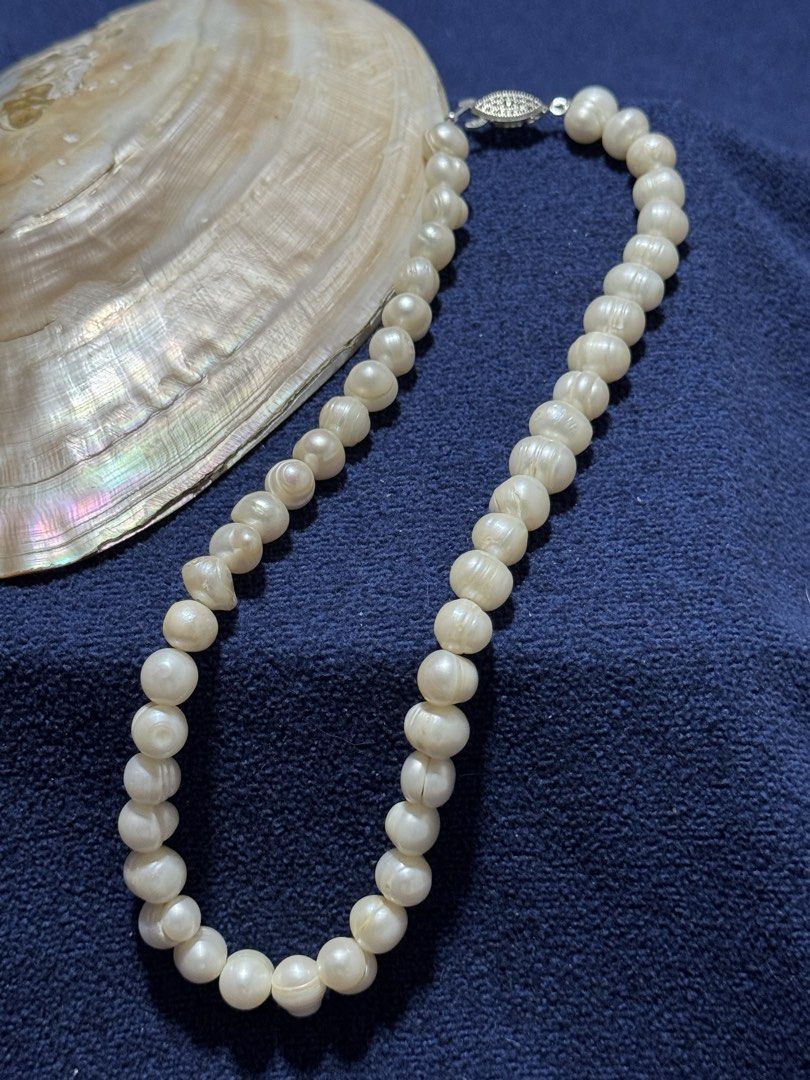 9 mm off-white, multi-texture pearl necklace (Category: Necklaces) located in Angeles City. Submitted by zyeplustradings (Listing ID 1465504907, Image 2). Description: off-white, multi-texture pearl necklace The pearls exhibit a distinct irregular, “potato” or “peanut” baroque shape rather than being perfectly spherical. Visible surface rings, ridges, and natural grooved indentations highlight their organic, authentic growth. .