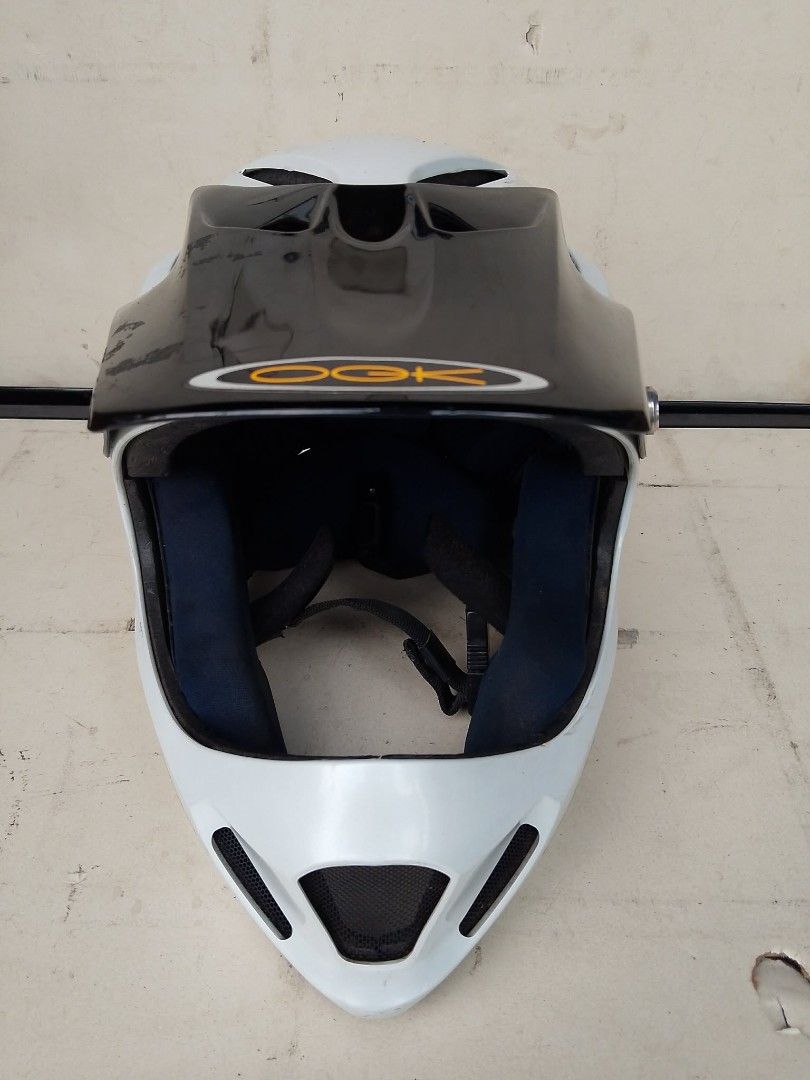 OGK Full Face Helmet White Black (Category: Caps & Hats) located in Quezon City. Submitted by jpnvintageonline (Listing ID 1465502603, Image 2). Description: - Brand: OGK full-face helmet - Color: White with a black visor and blue interior padding - Features: Top ventilation ports and front chin guard mesh grille - Custom detail: Includes a T. Taniguchi sticker on the side - Condition: Light scuffs from normal use, overall in good shape AS IS WHE