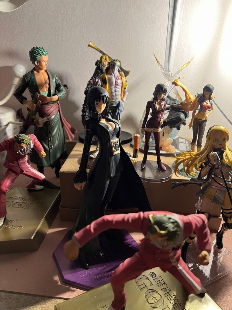 One Piece Roronoa Zoro Battle Version Figure (Category: Figurines & Statues) located in Manila. Submitted by cterrineni76861 (Listing ID 1465476740, Image 3). Description: - Official Roronoa Zoro collectible figure - Dynamic battle pose with sword effects - Detailed sculpt featuring green hair and dark robes - Sturdy branded hexagonal base with smoke effect - Perfect for anime displays - Condition: Loose item, no box included.