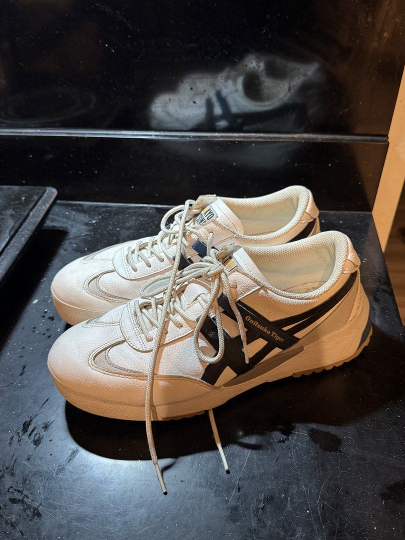 Onitsuka Tiger Delegation EX US 9 (Category: Sneakers) located in Makati City. Submitted by mattsrqz (Listing ID 1465530001, Image 1). Description: - Authentic Tokyo Onitsuka white leather sneakers - Iconic black side stripes with blue branding details - Chunky textured soles with rugged tread for better grip - Padded collar for extra comfort - Standard lace-up design with matching white laces - Clean uppers with only minor, normal creasing from 