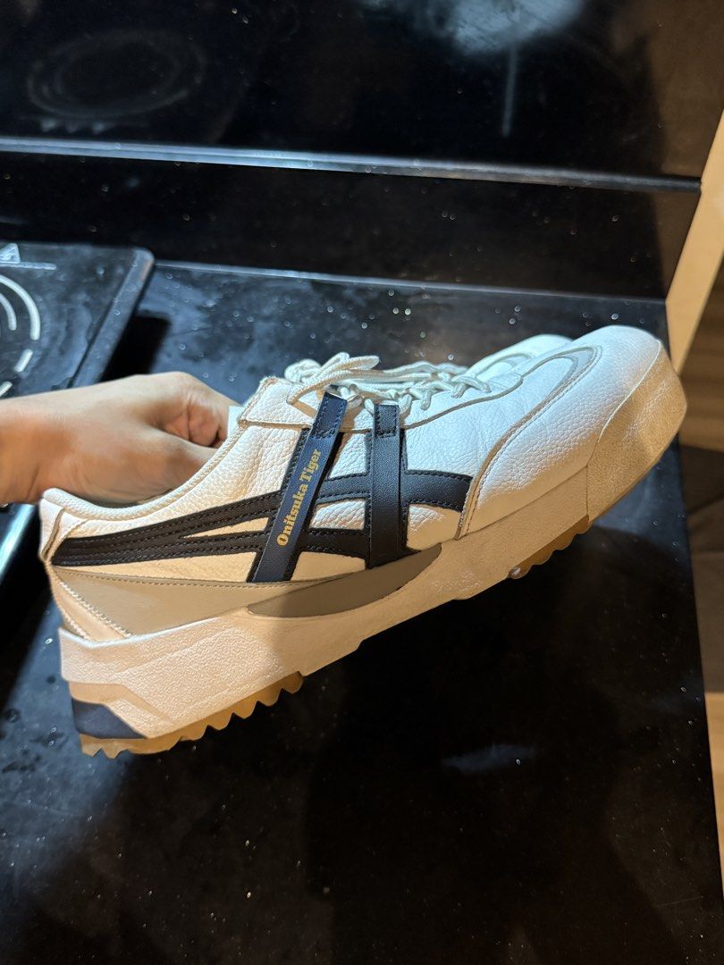 Onitsuka Tiger Delegation EX US 9 (Category: Sneakers) located in Makati City. Submitted by mattsrqz (Listing ID 1465530001, Image 3). Description: - Authentic Tokyo Onitsuka white leather sneakers - Iconic black side stripes with blue branding details - Chunky textured soles with rugged tread for better grip - Padded collar for extra comfort - Standard lace-up design with matching white laces - Clean uppers with only minor, normal creasing from 