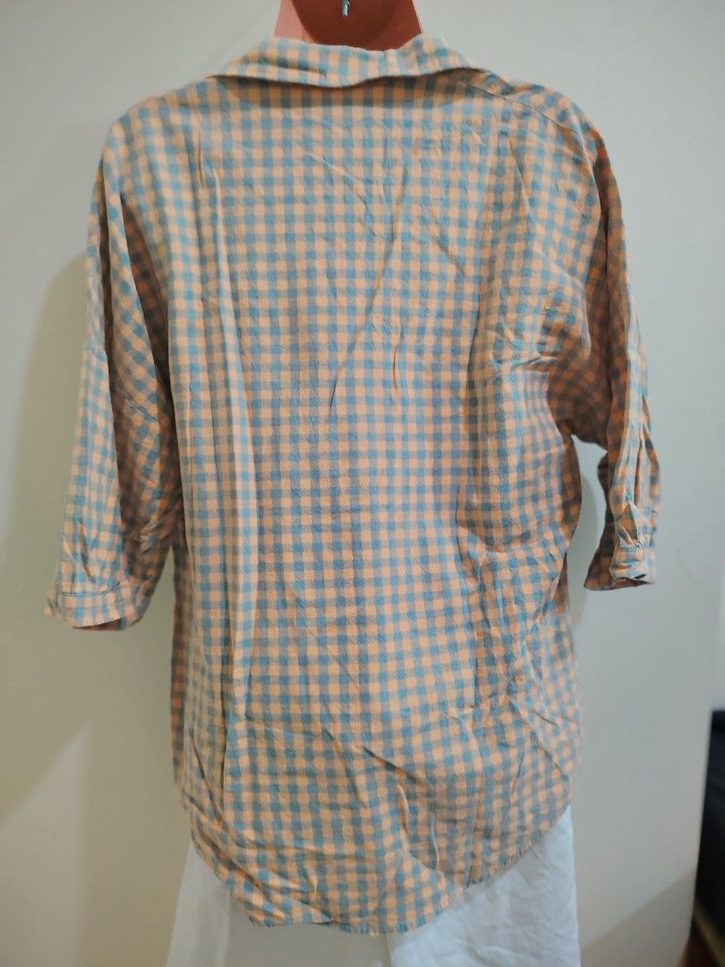 Orange and Blue Gingham Button-Up Shirt (Category: Tshirts & Polo Shirts ) located in Quezon City. Submitted by timelesstreasure117 (Listing ID 1465553160, Image 3). Description: Can fit from small to medium Good condition ₱35 Buyer books courier of choice Payment via gcash or paymaya.