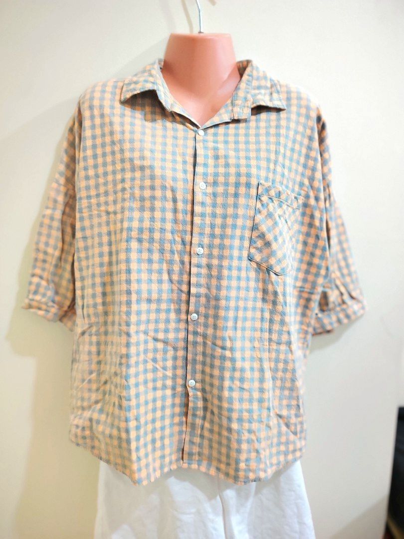 Orange and Blue Gingham Button-Up Shirt (Category: Tshirts & Polo Shirts ) located in Quezon City. Submitted by timelesstreasure117 (Listing ID 1465553160, Image 1). Description: Can fit from small to medium Good condition ₱35 Buyer books courier of choice Payment via gcash or paymaya.