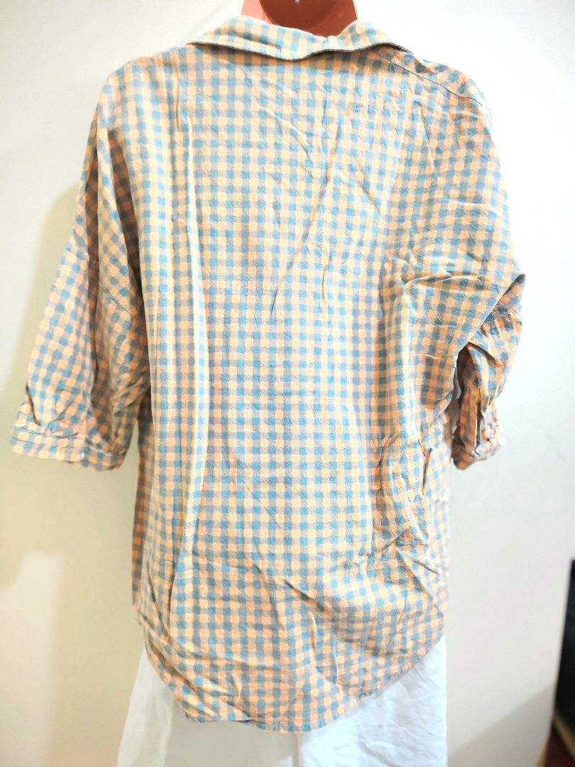 Orange and Blue Gingham Button-Up Shirt (Category: Tshirts & Polo Shirts ) located in Quezon City. Submitted by timelesstreasure117 (Listing ID 1465553160, Image 2). Description: Can fit from small to medium Good condition ₱35 Buyer books courier of choice Payment via gcash or paymaya.