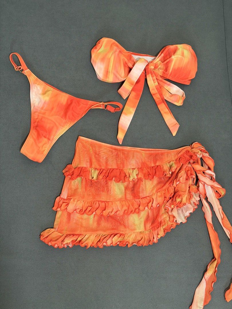 Orange Tie-Dye Bikini Set with Ruffle Skirt (Category: Bikinis & Swimsuits) located in Manila. Submitted by rhei.preloved (Listing ID 1465439551, Image 2). Description: 3 piece bikini set USED ONCE ‼️.