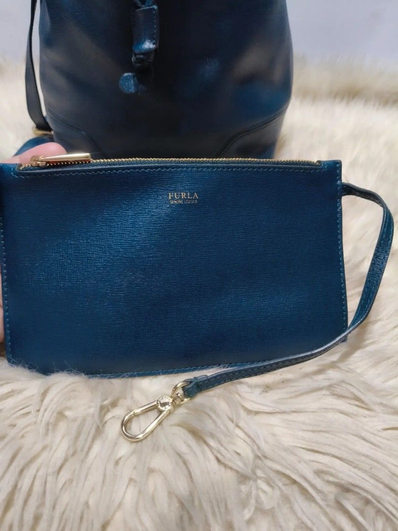Original FURLA (Category: Shoulder Bags) located in Cabuyao City. Submitted by secondhand.shop.ph (Listing ID 1465540540, Image 2). Description: Sale❗️Sale❗️Sale❗️ ₱ 2,699 Original FURLA Preloved w/ pouch and sling strap Teal Blue Medium Pure genuine leather 📌First to pay!.