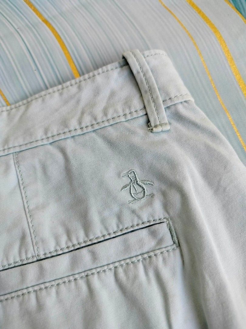 Original Penguin Light Blue Shorts Size 38 (Category: Shorts) located in Manila. Submitted by virgiliosa38485 (Listing ID 1465503673, Image 2). Description: - Brand: Original Penguin - Color: Light Blue - Size: 38-40 -Length 21 - Details: Dark floral inner waistband lining, embroidered penguin logo above back pocket - Closure: Button closure with zip fly - Pockets: Standard front and back pockets.