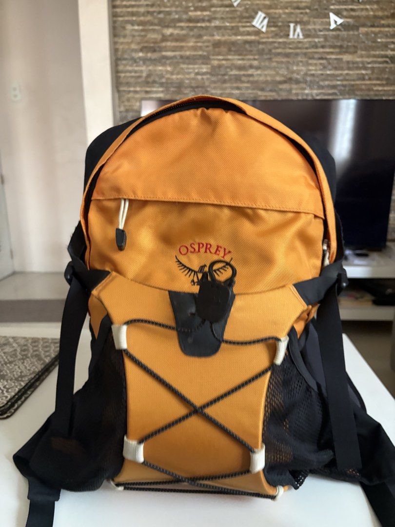 Osprey Backpack Yellow and Black (Category: Backpacks) located in Manila. Submitted by kakiboyo (Listing ID 1465392997, Image 3). Description: - Authentic Osprey backpack in a bright yellow and black colorway - Secure drawstring top closure with a heavy-duty clip - Convenient exterior zippered front pocket and elastic bungee cord for extra gear - Breathable mesh side pockets for water bottles or small items - Molded grey back panel with padded sh