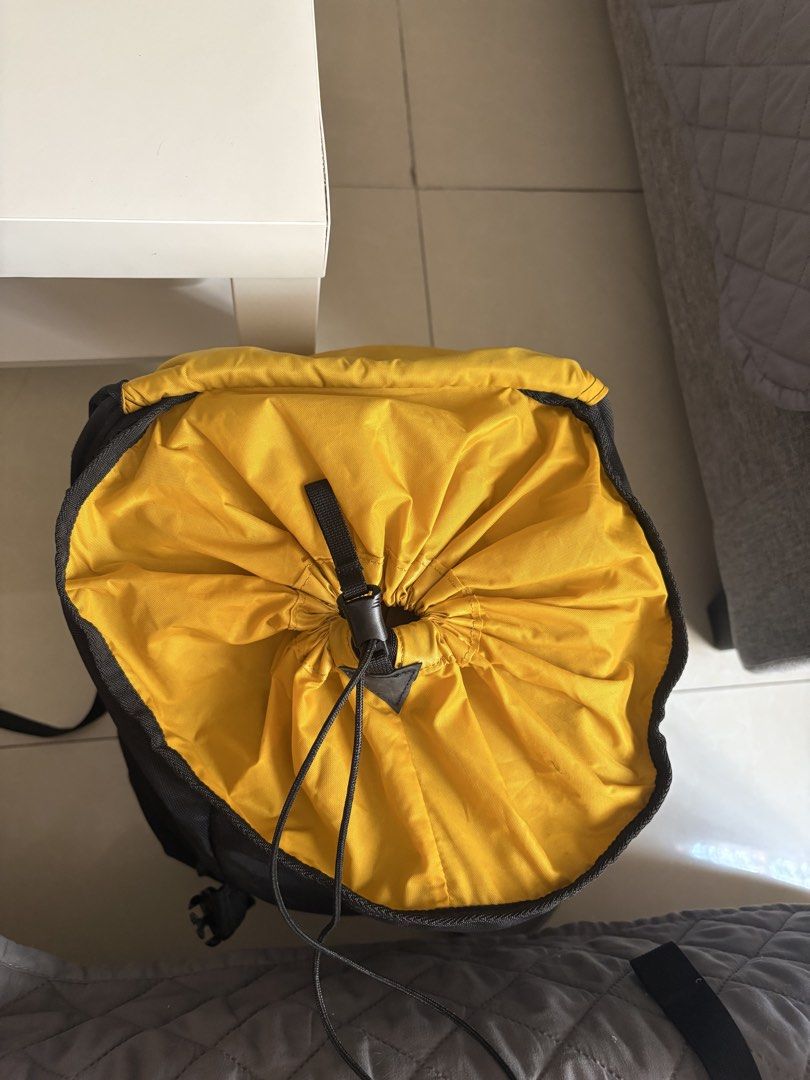 Osprey Backpack Yellow and Black (Category: Backpacks) located in Manila. Submitted by kakiboyo (Listing ID 1465392997, Image 1). Description: - Authentic Osprey backpack in a bright yellow and black colorway - Secure drawstring top closure with a heavy-duty clip - Convenient exterior zippered front pocket and elastic bungee cord for extra gear - Breathable mesh side pockets for water bottles or small items - Molded grey back panel with padded sh