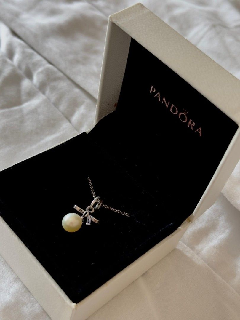 Pandora Bow Pearl Necklace (Category: Necklaces) located in Muntinlupa City. Submitted by aremvy (Listing ID 1465549680, Image 2). Description: - Includes original chain - Classic, versatile design perfect for daily wear.
