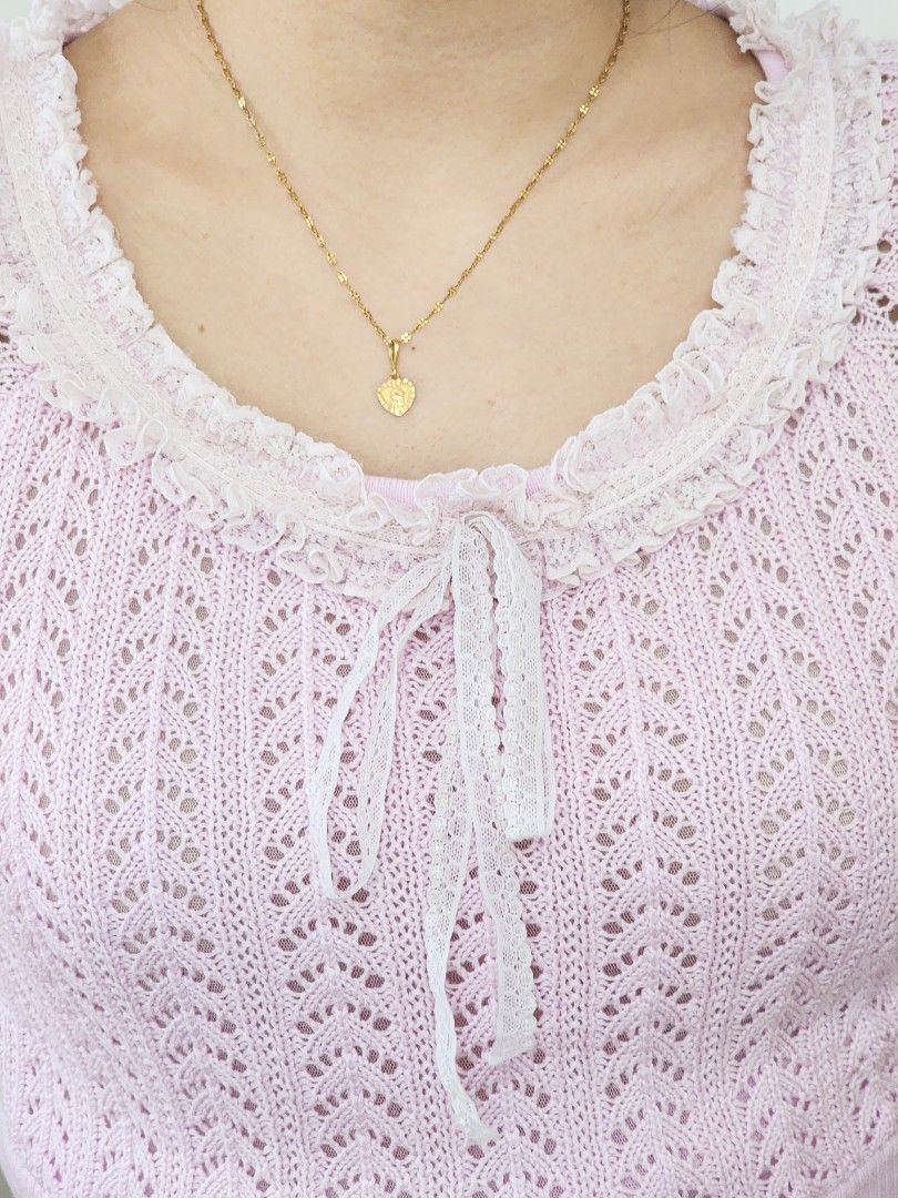 pastel pink knitted top (Category: Sleeveless) located in Batangas. Submitted by curatedbylisilaloop (Listing ID 1465431861, Image 3). Description: VIOLA PER DONNA | pastel pink knit lace trim front tie top | w/ minimal lace runs Size: freesize Bust: 34-38".