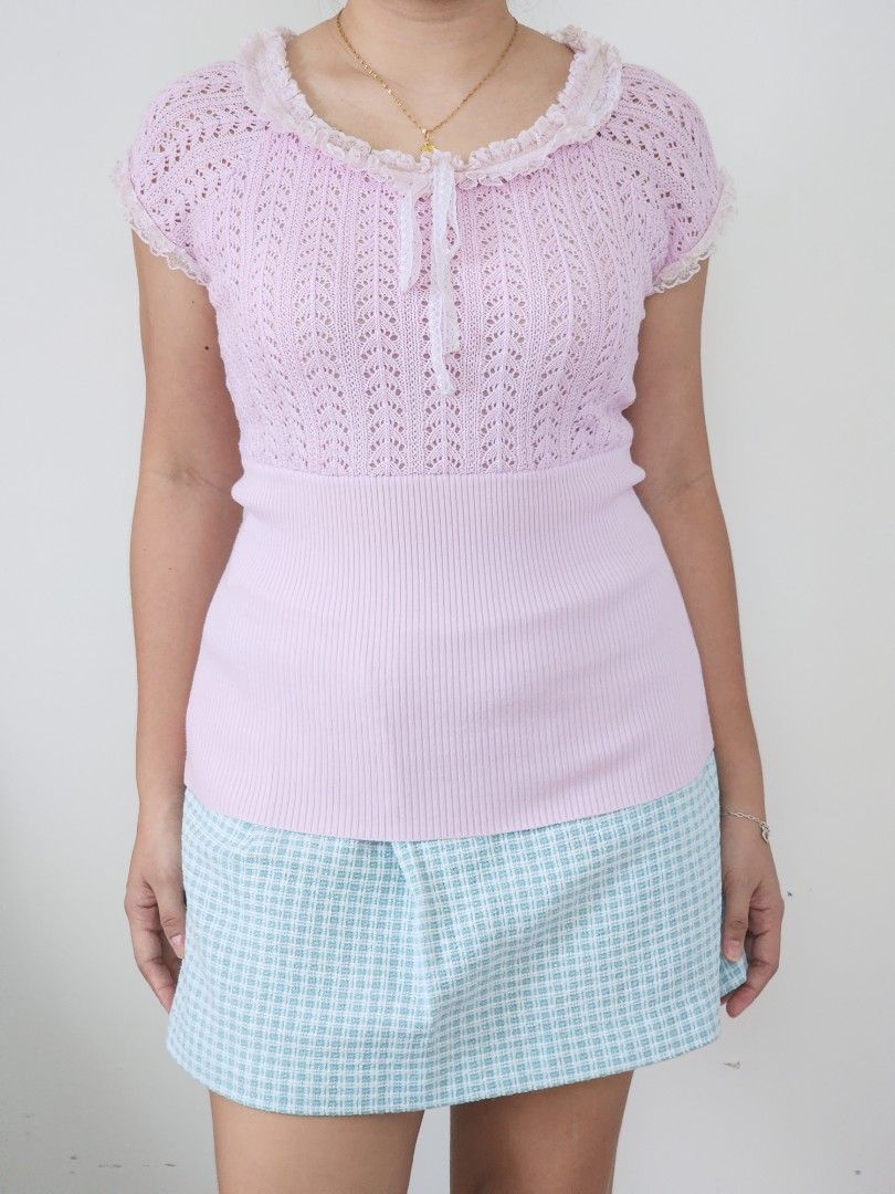 pastel pink knitted top (Category: Sleeveless) located in Batangas. Submitted by curatedbylisilaloop (Listing ID 1465431861, Image 1). Description: VIOLA PER DONNA | pastel pink knit lace trim front tie top | w/ minimal lace runs Size: freesize Bust: 34-38".