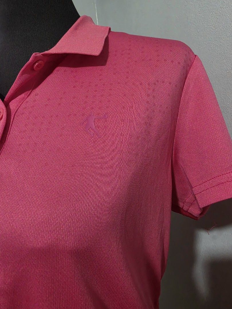 Pink Athletic Polo Shirt large (Category: Shirts) located in Paranaque City. Submitted by franinnashop (Listing ID 1465440555, Image 2). Description: DECLUTTER LARGE PARANAQUE CITY - Color: Bright pink - Design: Short sleeves, standard collar, three-button placket - Detail: Subtle dotted pattern on upper chest and shoulders with small embroidered athletic logo - Material: Smooth, breathable fabric - Best for: Workouts or casual wear.