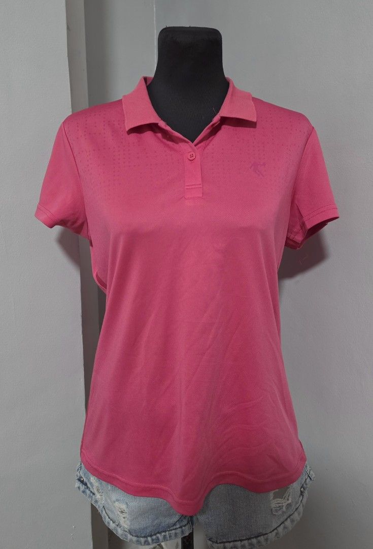 Pink Athletic Polo Shirt large (Category: Shirts) located in Paranaque City. Submitted by franinnashop (Listing ID 1465440555, Image 1). Description: DECLUTTER LARGE PARANAQUE CITY - Color: Bright pink - Design: Short sleeves, standard collar, three-button placket - Detail: Subtle dotted pattern on upper chest and shoulders with small embroidered athletic logo - Material: Smooth, breathable fabric - Best for: Workouts or casual wear.