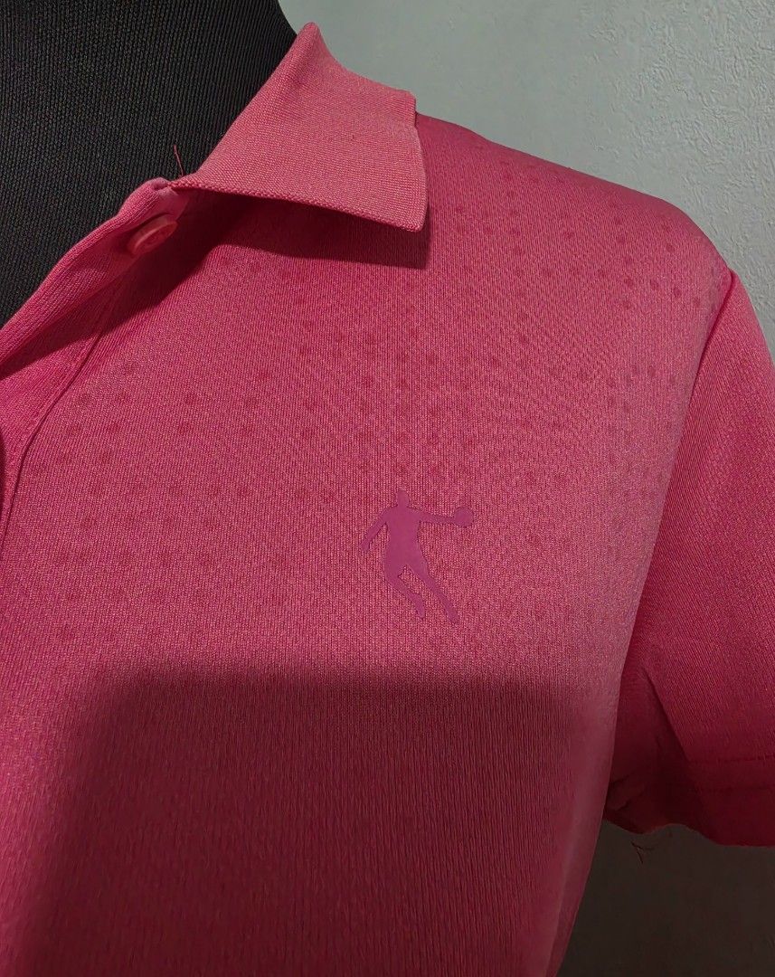 Pink Athletic Polo Shirt large (Category: Shirts) located in Paranaque City. Submitted by franinnashop (Listing ID 1465440555, Image 3). Description: DECLUTTER LARGE PARANAQUE CITY - Color: Bright pink - Design: Short sleeves, standard collar, three-button placket - Detail: Subtle dotted pattern on upper chest and shoulders with small embroidered athletic logo - Material: Smooth, breathable fabric - Best for: Workouts or casual wear.