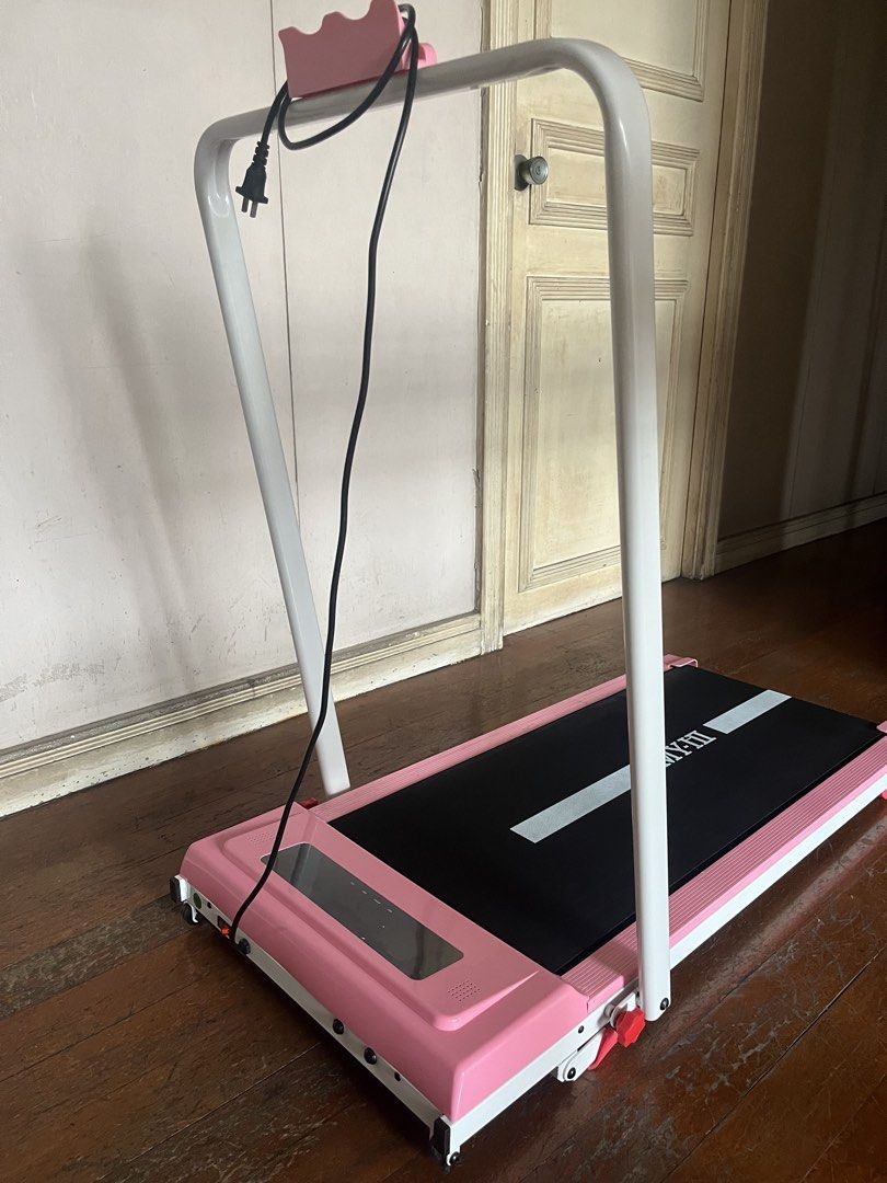 Pink MY-HI Treadmill/Walking pad (Category: Cardio & Fitness Machines) located in Makati City. Submitted by seedkneeee (Listing ID 1465398017, Image 2). Description: - Color: Stylish pink - Condition: Tested and fully working (purchased from Zone Mall) - Speed & Incline: 1-10 km/h speed range with 0-9 degree slope adjustment - Comfort: Built-in bottom shock pad to protect your joints - Convenience: Includes remote control for easy adjustments - S