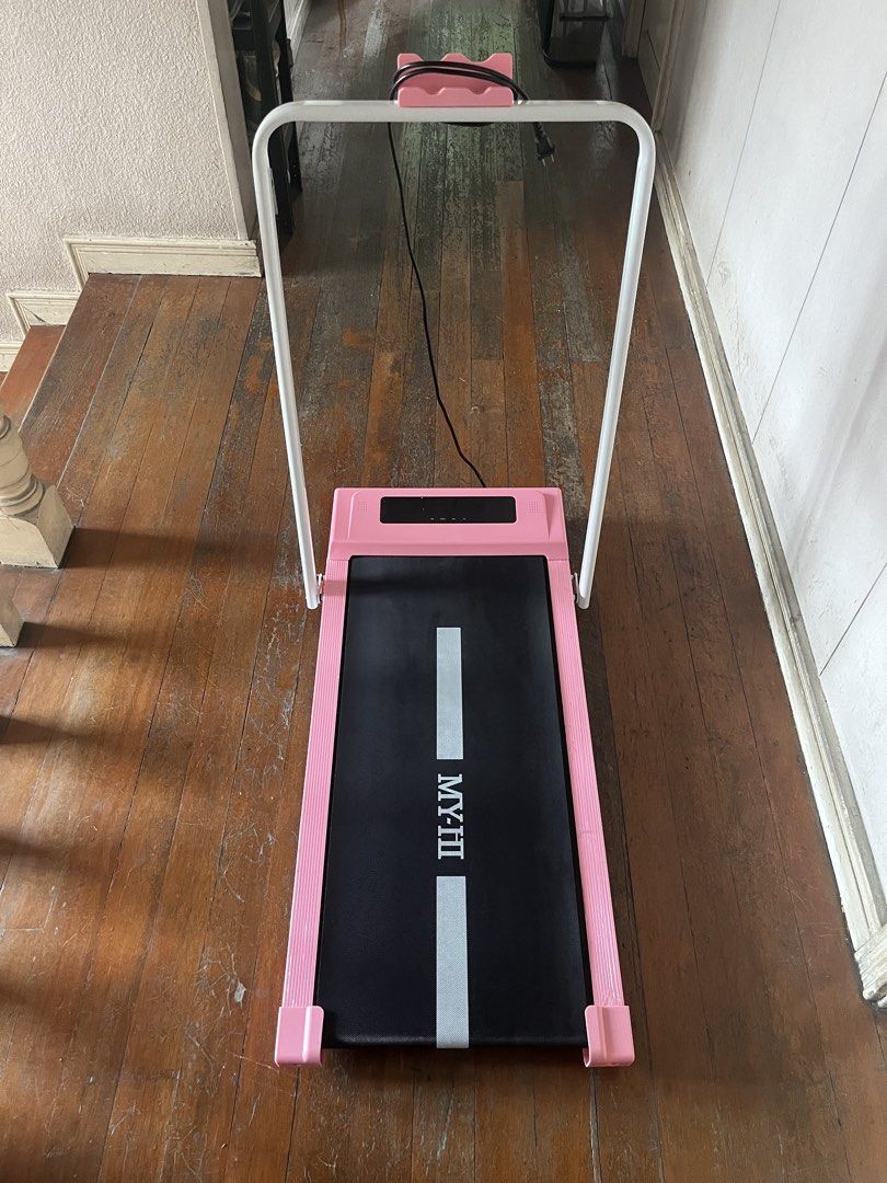 Pink MY-HI Treadmill/Walking pad (Category: Cardio & Fitness Machines) located in Makati City. Submitted by seedkneeee (Listing ID 1465398017, Image 1). Description: - Color: Stylish pink - Condition: Tested and fully working (purchased from Zone Mall) - Speed & Incline: 1-10 km/h speed range with 0-9 degree slope adjustment - Comfort: Built-in bottom shock pad to protect your joints - Convenience: Includes remote control for easy adjustments - S