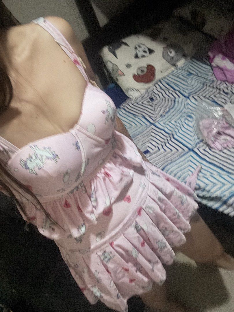 Pink unicorn print pleated Swimsuit (Category: Bikinis & Swimsuits) located in Pasig City. Submitted by oinkrowie (Listing ID 1465497973, Image 1). Description: - Adorable pink swimsuit with unicorn and heart prints - Structured bodice with cup details for a flattering fit - Layered ruffled skirt for a fun, playful look - Adjustable straps for comfort and easy sizing - Great for casual hangouts, dates, or themed parties - Comfortable material tha