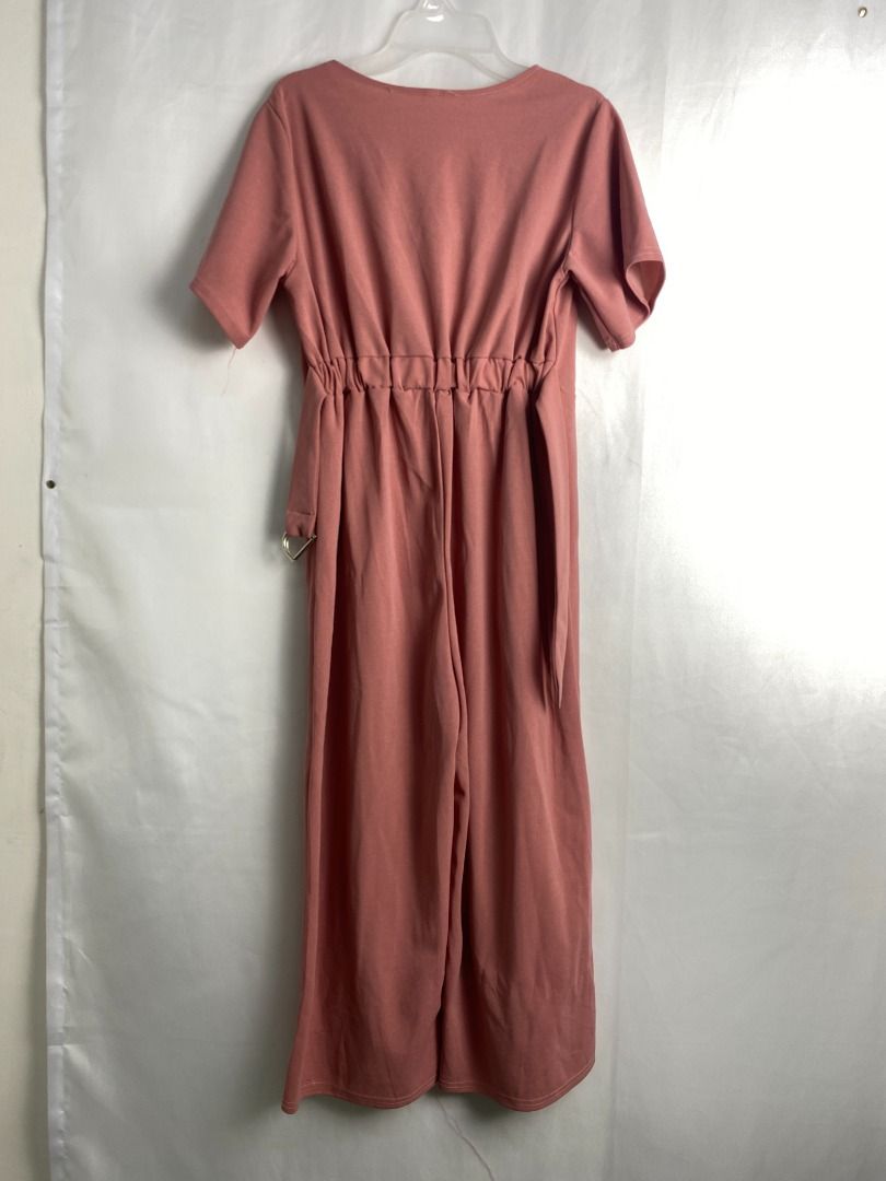 Pink V-neck short sleeve button front jumpsuit (Category: Jumpsuits) located in Quezon City. Submitted by theusualneed (Listing ID 1465436958, Image 2). Description: - Color: Dusty pink - Design: Short sleeves, V-neck, and front placket with two marbled buttons - Fit: Elastic waistband for a cinched middle and a trendy wide-leg cut - Material: Smooth fabric with a subtle texture - Condition: Excellent, clean hems with zero visible wear - Size: Sm