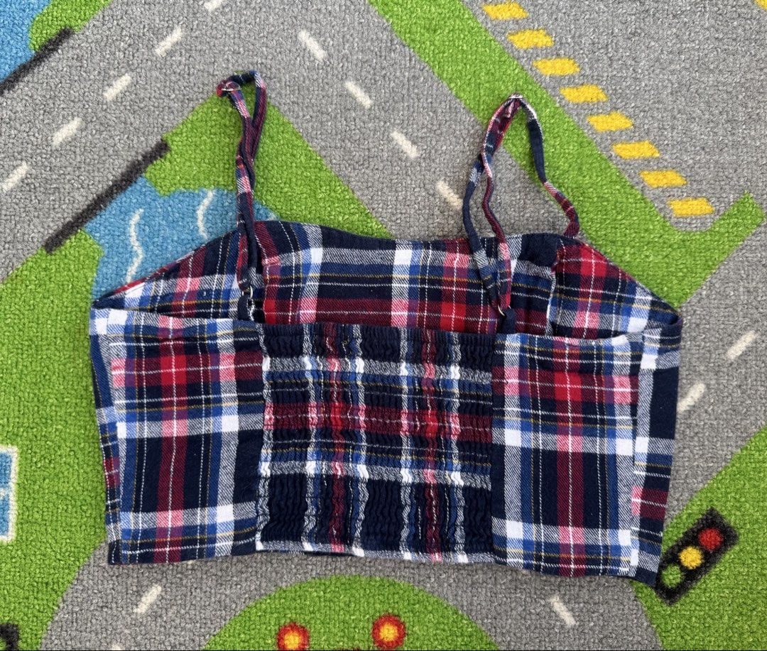 Plaid Cami Crop Top with Smocked Back (Category: Babies & Kids Fashion) located in Rizal. Submitted by preloovved (Listing ID 1465494912, Image 2). Description: Super cute red, blue, and white plaid crop top featuring a square neckline, thin straps, and a stretchy smocked back. Made from soft flannel material, this top is easy to style with high-waisted jeans or skirts for a casual day out. Preloved, 12yo, size XS Meet-up only in GB1 San Mateo, R