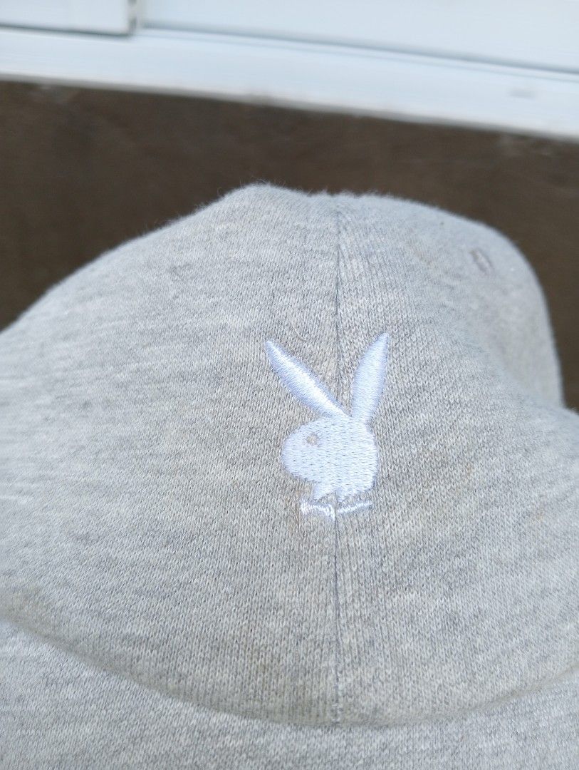 Playboy Grey Embroidered Bunny Logo Baseball Cap (Category: Caps & Hats) located in Manila. Submitted by trifted.lootsph (Listing ID 1465400632, Image 2). Description: - Authentic Playboy baseball cap in versatile grey - Classic white embroidered bunny logo on the front - Adjustable back strap with a durable metal slider buckle - Lightweight and clean fabric blend (50% polyester, 45% cotton, 5% rayon) - Manufactured by GTO Co., Ltd., Made in Chin
