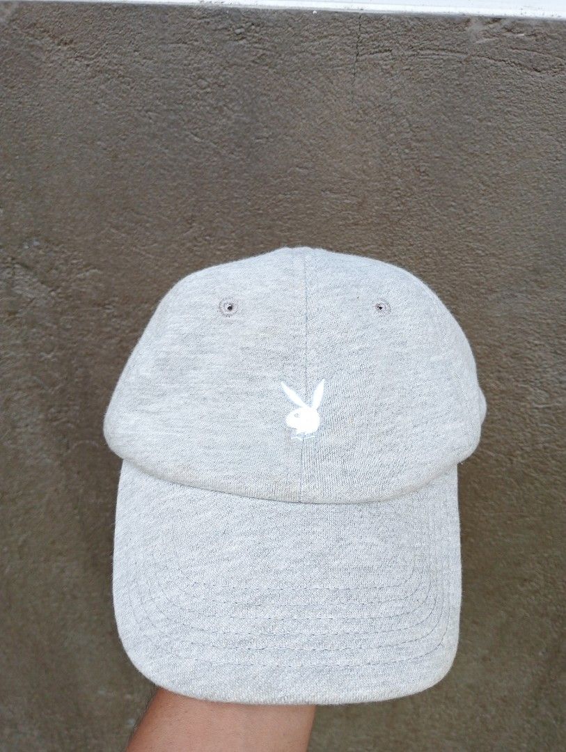 Playboy Grey Embroidered Bunny Logo Baseball Cap (Category: Caps & Hats) located in Manila. Submitted by trifted.lootsph (Listing ID 1465400632, Image 1). Description: - Authentic Playboy baseball cap in versatile grey - Classic white embroidered bunny logo on the front - Adjustable back strap with a durable metal slider buckle - Lightweight and clean fabric blend (50% polyester, 45% cotton, 5% rayon) - Manufactured by GTO Co., Ltd., Made in Chin