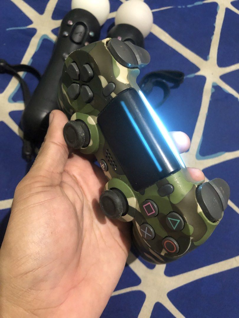 Playstation Move VR controller and PS4 Camou controller (Category: Controllers) located in Quezon City. Submitted by markgolveo (Listing ID 1465451728, Image 2). Description: Playstation Move VR controller and PS4 Camou controller No set breaking VR controller untested 1pc power charging 1pc powers on only when plugged PS4 controller good power battery life and buttons.