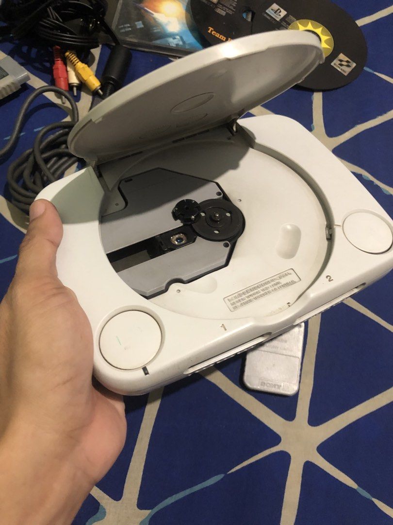 Playstation One - Defective with power (Category: PlayStation) located in Quezon City. Submitted by markgolveo (Listing ID 1465450754, Image 3). Description: Playstation One - Defective with power PS One ntsc Jpn Borrowed an adapter to test with power disc not spinning defective for parts out repairs With authentic av cable 1pc standard ps controller 1pc authentic memory card with case 3 Pcs ps1 black discs jpn No power adapter included.