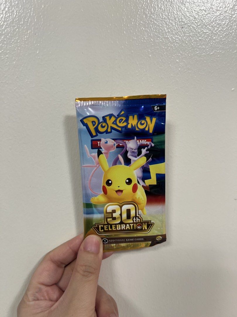 Pokémon 30th Celebration Booster Pack English (Category: Card Packs) located in Manila. Submitted by heavenly0 (Listing ID 1465523867, Image 1). Description: Slightly negotiable - Authentic Pokémon 30th Celebration booster pack - Features iconic artwork of Pikachu, Mew, and Mewtwo - Contains 5 game cards inside - Clean packaging, ideal for display or collection - Great gift for Pokémon TCG fans and collectors.