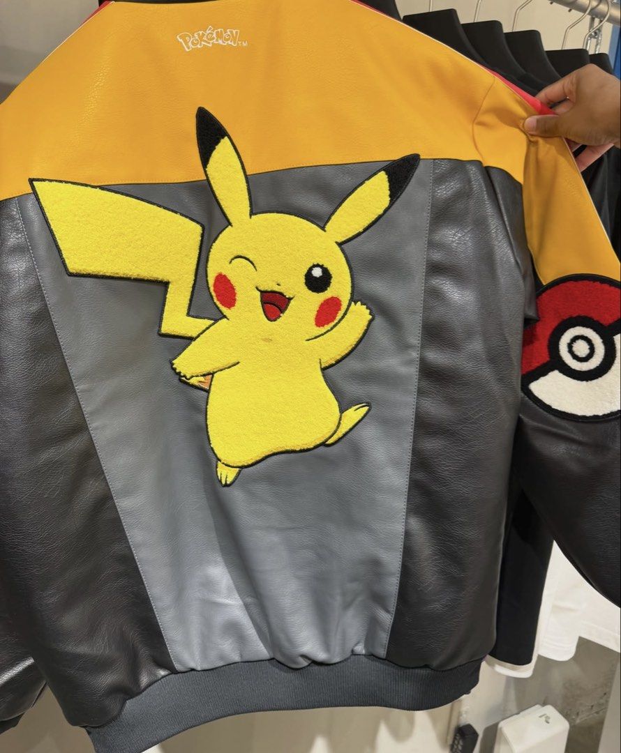 Pokémon x Adidas Jackets and Tees (Category: Coats, Jackets and Outerwear) located in Santa Rosa. Submitted by badassvj (Listing ID 1465455450, Image 2). Description: - Official Pokémon x Adidas streetwear collection - Leather-style bomber jackets with sleeve patches and large character graphics (Gengar, Pikachu, Charizard) - Black cotton tees featuring Adidas trefoil logos mixed with Pokémon characters (Gengar, Rayquaza, Charizard) - Perfect pic