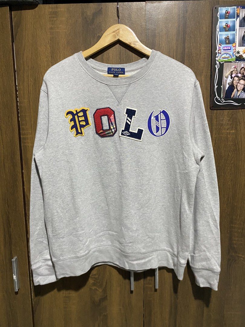 Polo Ralph Lauren Grey Patchwork Sweatshirt (Category: Coats, Jackets and Outerwear) located in Antipolo. Submitted by cogiestamaria (Listing ID 1465426939, Image 1). Description: - Brand: Polo Ralph Lauren - Color: Grey - Design: Colorful varsity letters with unique fabrics and textures across the chest, classic crewneck with collar triangle insert, ribbed cuffs and hem - Size: Youth XL (18-20), fits smaller than a standard men's Large - dimes W
