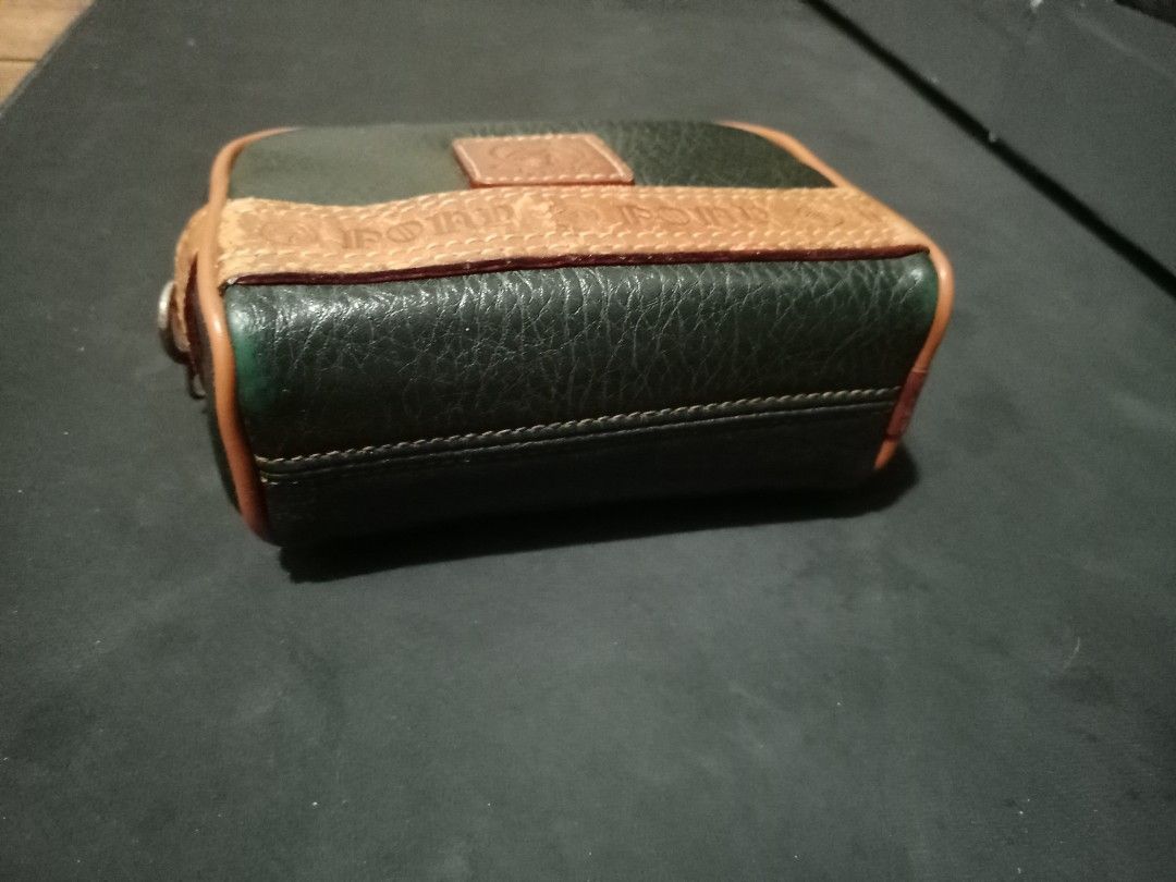 Pony Brand Leather Pouch Green Tan (Category: Luxury Bags & Wallets) located in Manila. Submitted by luckyeagle-7ff8 (Listing ID 1465478375, Image 2). Description: - Color & Material: Green textured leather with chic tan trim accents - Design: Features embossed pony text and a classic stamped logo patch - Versatile Carry: Includes sturdy belt loops on the back for waist or belt bag styling - Closure: Smooth zipper closure running along the top an