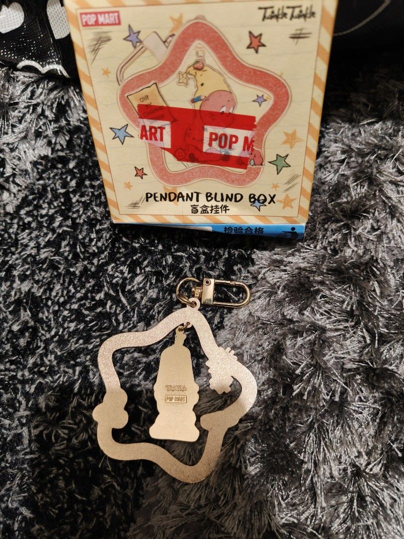 Pop mart twinkle twinkle pendant (Category: Designer & Blind Box Toys) located in Pasay City. Submitted by biancabee25 (Listing ID 1465532831, Image 2). Description: complete inclusions unused, bought from Pop mart Hong Kong with small scratch on top part back due to storage.