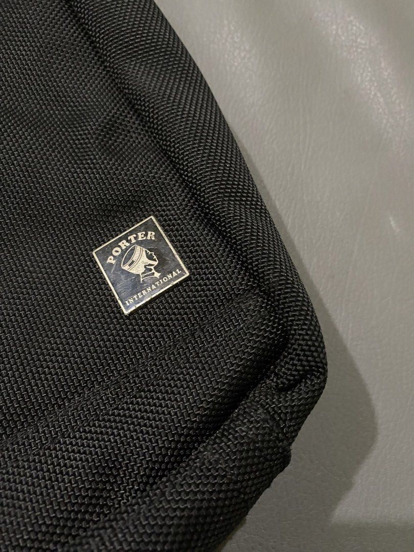 Porter International Black Messenger Bag with Mini Torch (Category: Sling Bags) located in Pozorrubio. Submitted by izaykite2g (Listing ID 1465579042, Image 3). Description: - Authentic Porter International black utility bag - Made from durable, textured nylon material - Includes signature matching branded mini flashlight on the zipper - Multiple functional compartments for easy organization - Adjustable shoulder strap and convenient top carry ha
