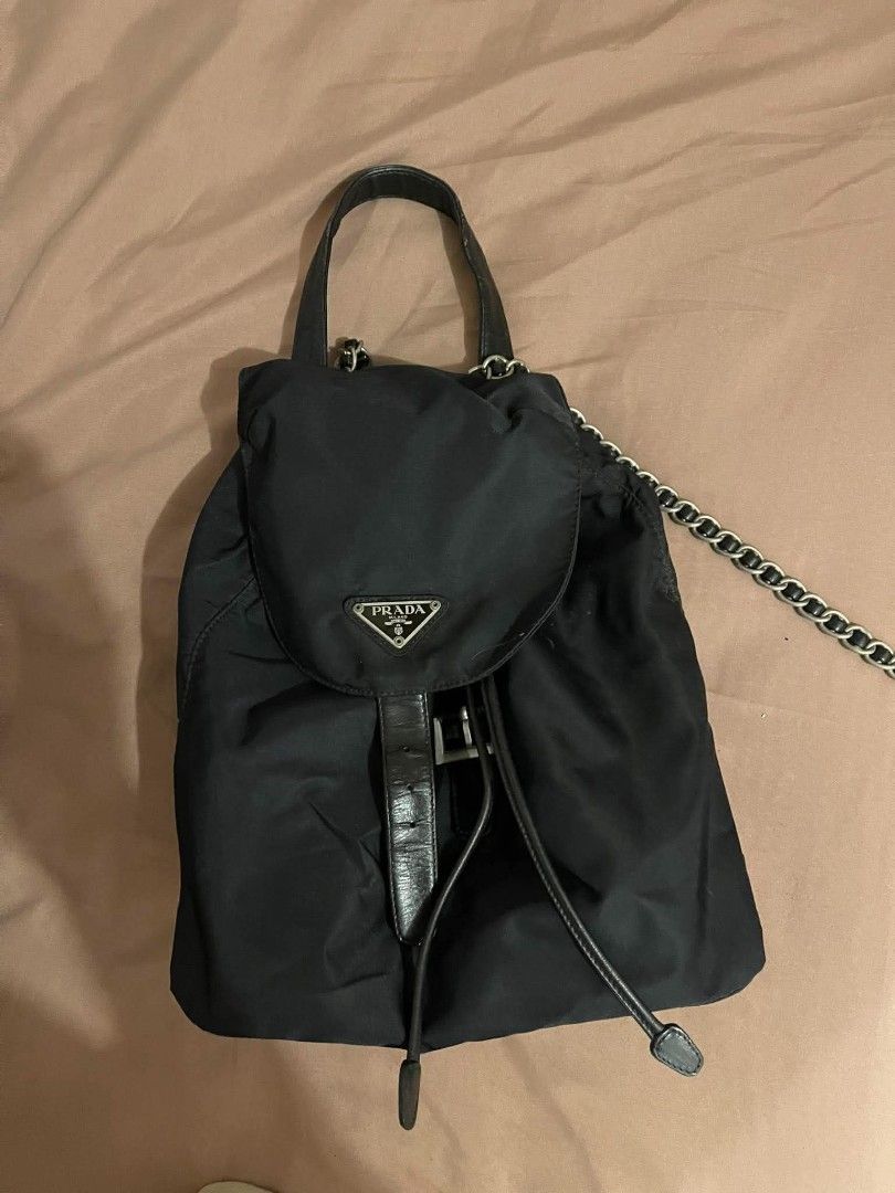 Prada Black Nylon Chain Backpack (Category: Backpacks) located in Las Pinas. Submitted by missfaust (Listing ID 1465405073, Image 1). Description: Authentic Prada Backpack Flaw: one strap is broken, patahi nyo nalang. Everything else good condition.